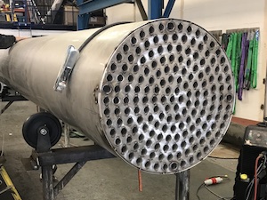 Biogas cooler tubes welded to end plate